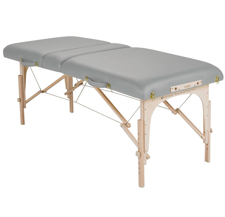 Earthlite Avalon XD Tilt Top portable massage table in light grey laying flat