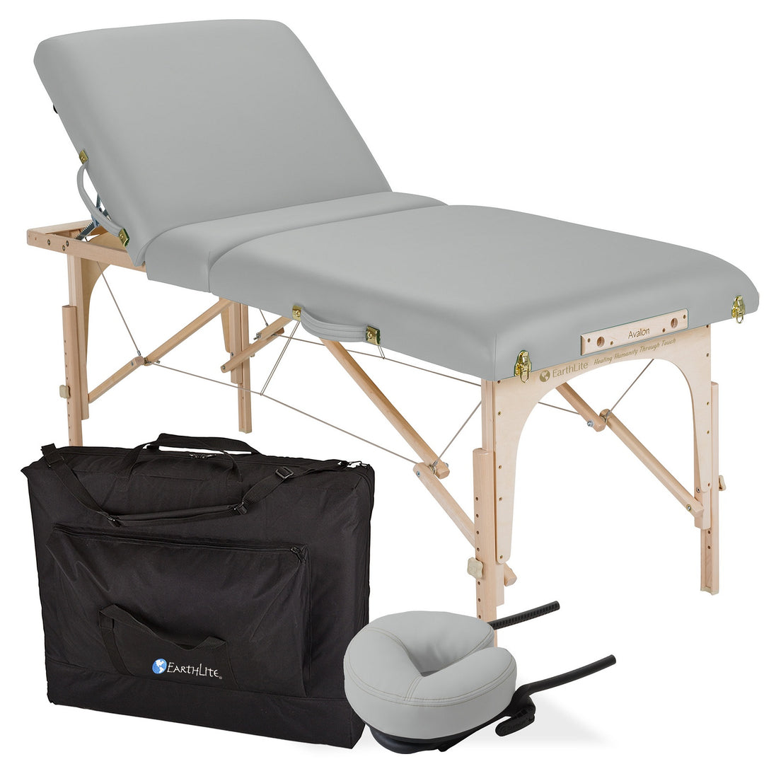 Earthlite Avalon XD Tilt Top portable massage table in light grey with back rest raised.  Carrying bag and head rest also depicted.