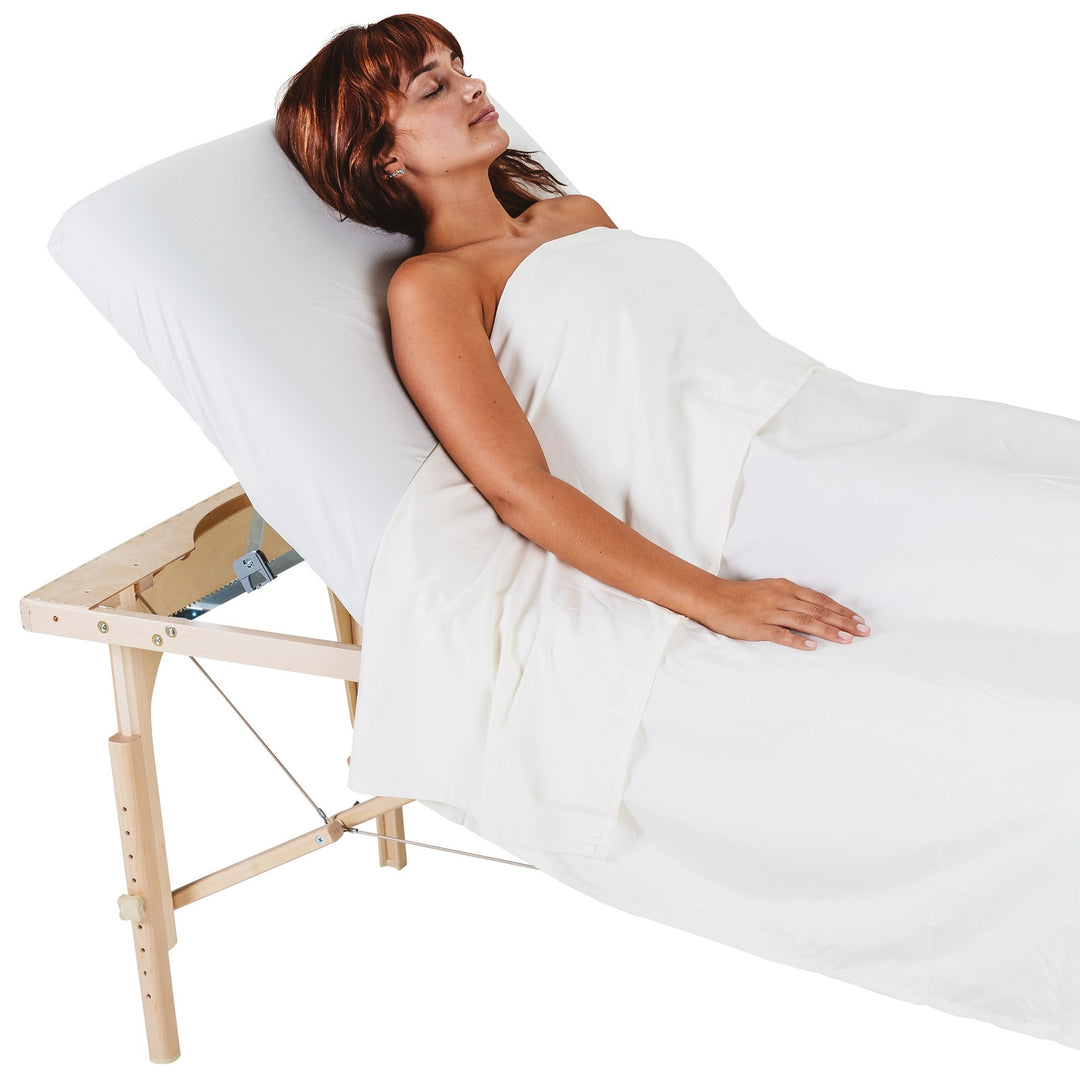 Patient laying in Avalon XD Tilt Top with back rest raised for treatment