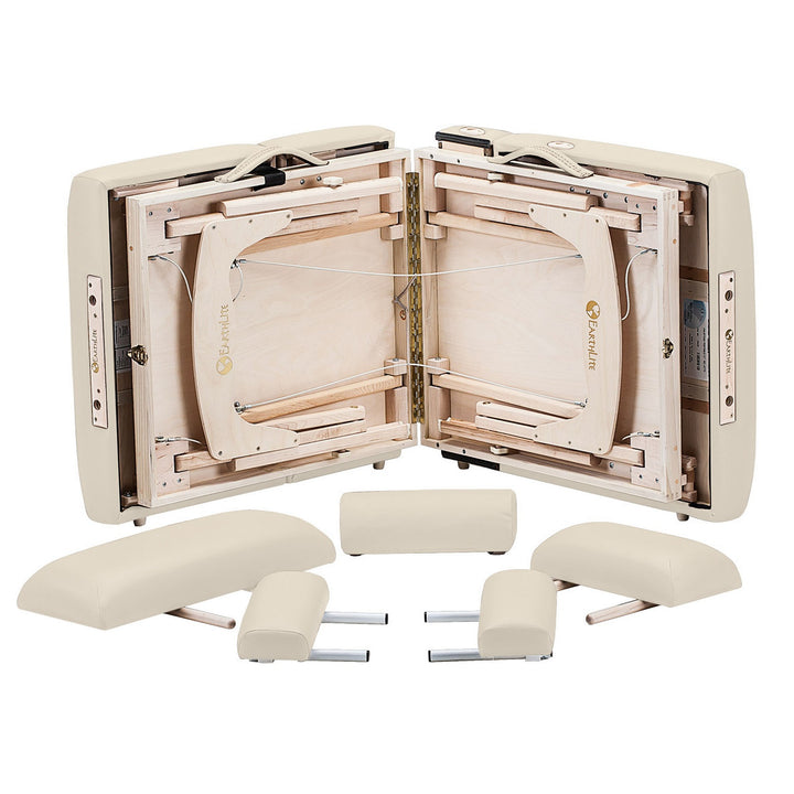 Earthlite Calistoga portable salon table with legs collapsed and head rest pillows surrounding